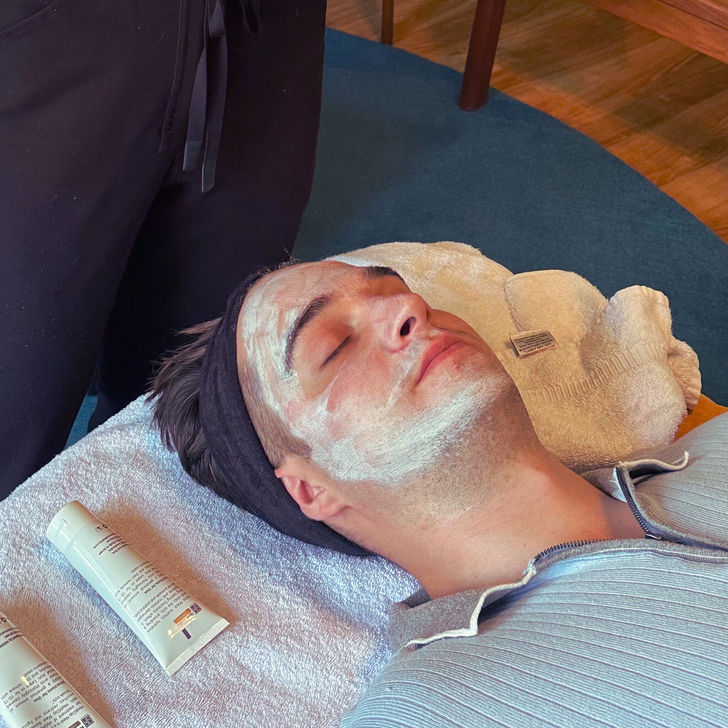 Man being treated with hydrating face mask for dry flaky skin